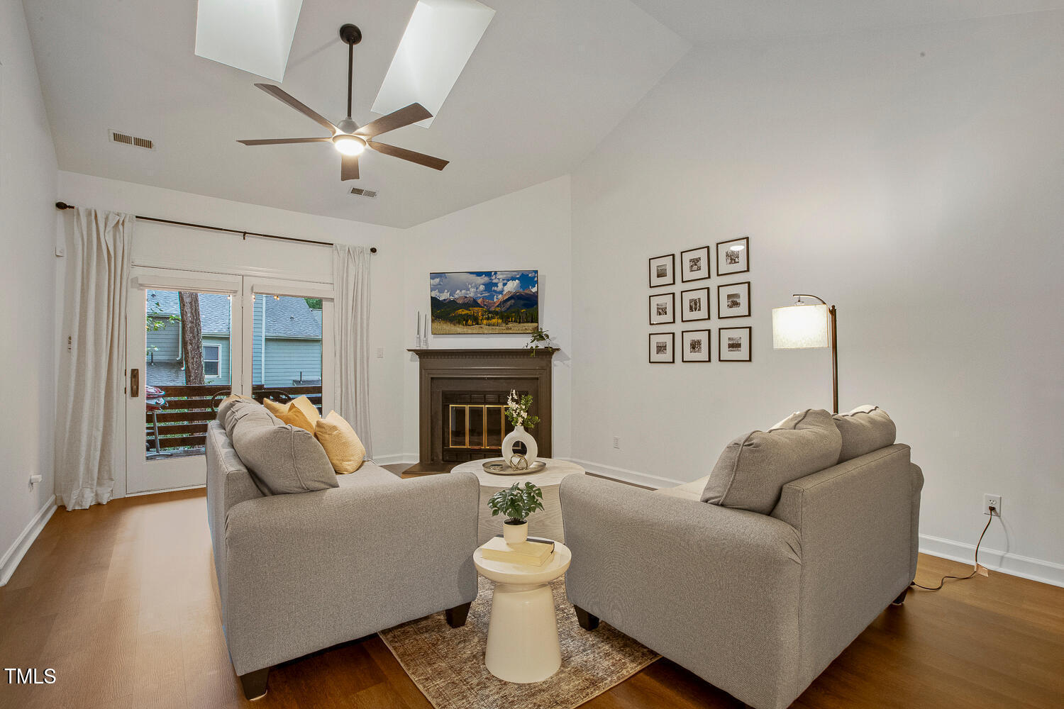 217 Danforth Drive Cary, NC 27511 - Photo 14 of 40 a living room with furniture and a fireplace