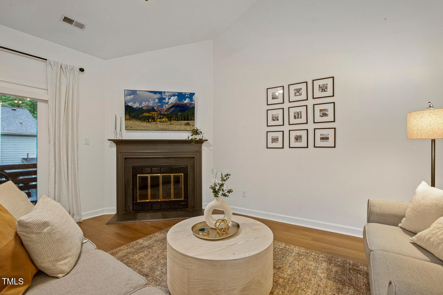 217 Danforth Drive Cary, NC 27511 - Photo 15 of 40 a living room with furniture and a fireplace