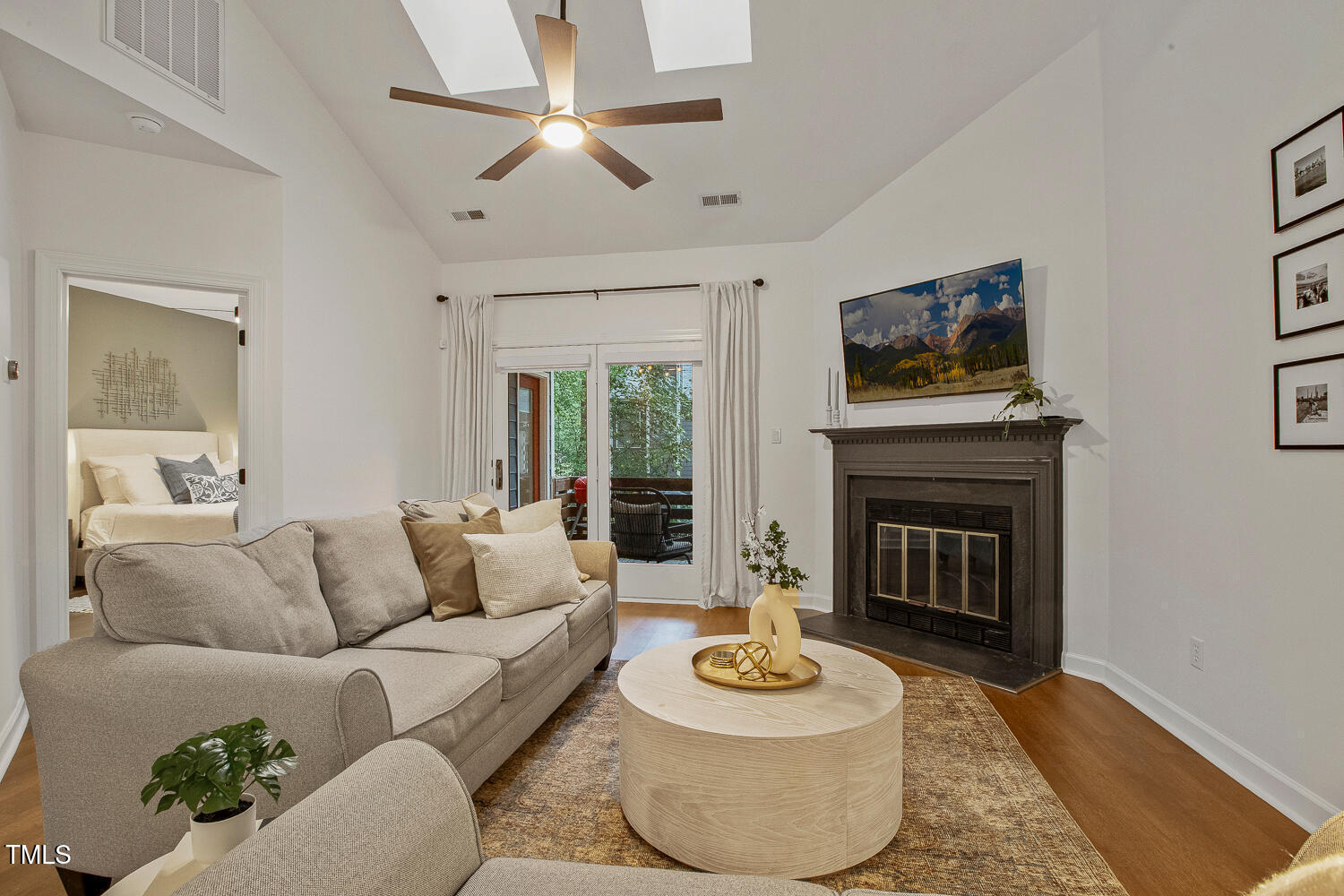 217 Danforth Drive Cary, NC 27511 - Photo 16 of 40 a living room with furniture and a fireplace
