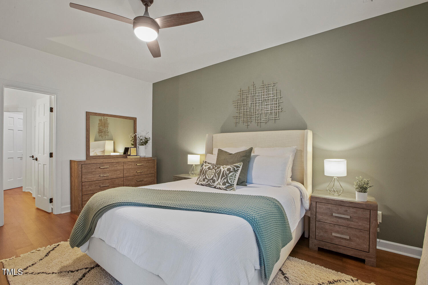 217 Danforth Drive Cary, NC 27511 - Photo 21 of 40 a bedroom with a large bed and a chandelier