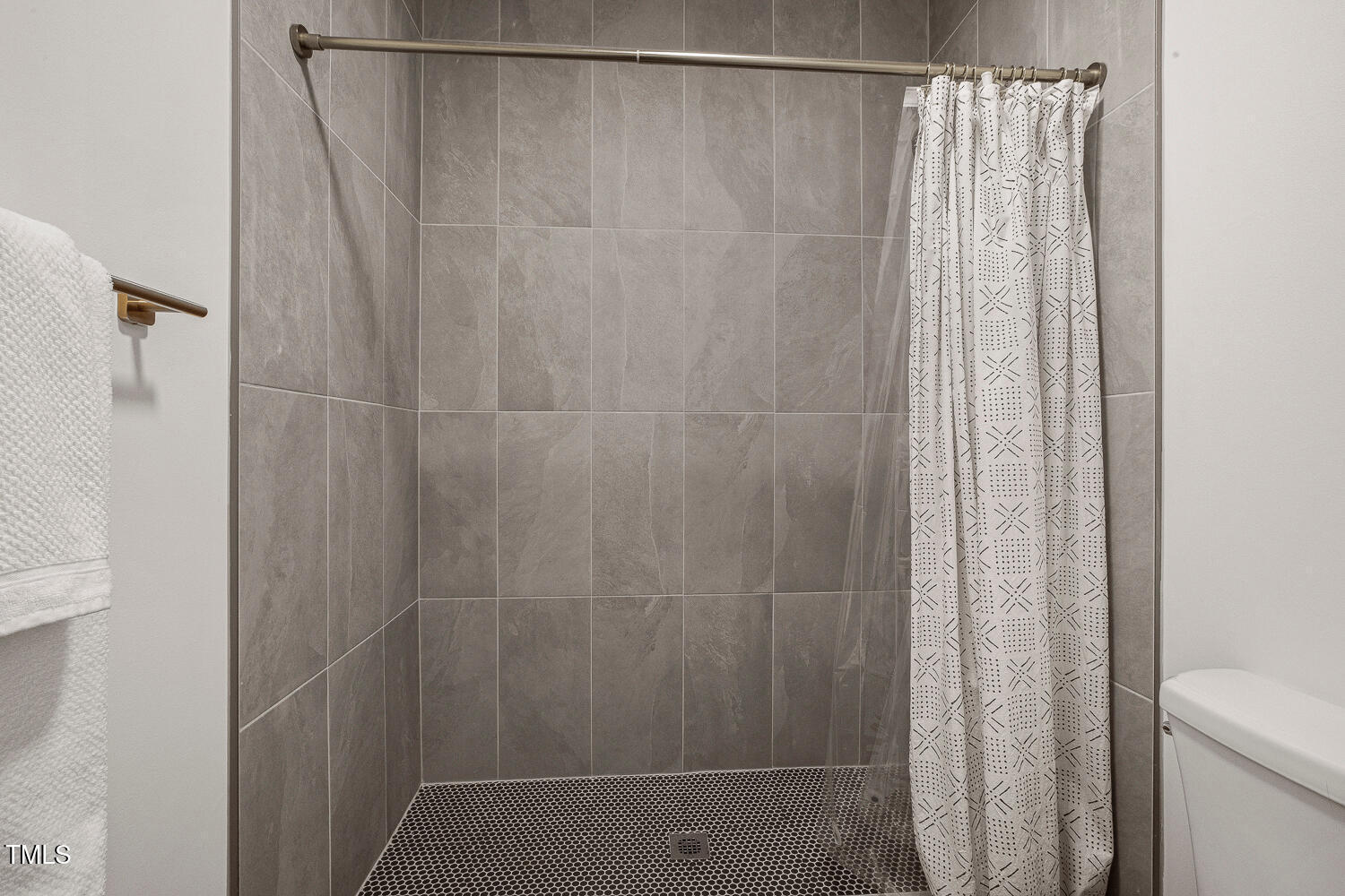 217 Danforth Drive Cary, NC 27511 - Photo 26 of 40 a bathroom with a shower and a toilet