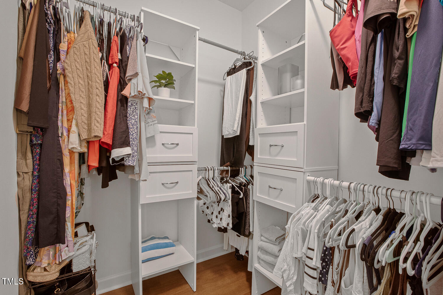 217 Danforth Drive Cary, NC 27511 - Photo 27 of 40 a view of walk in closet with clothes and shoes