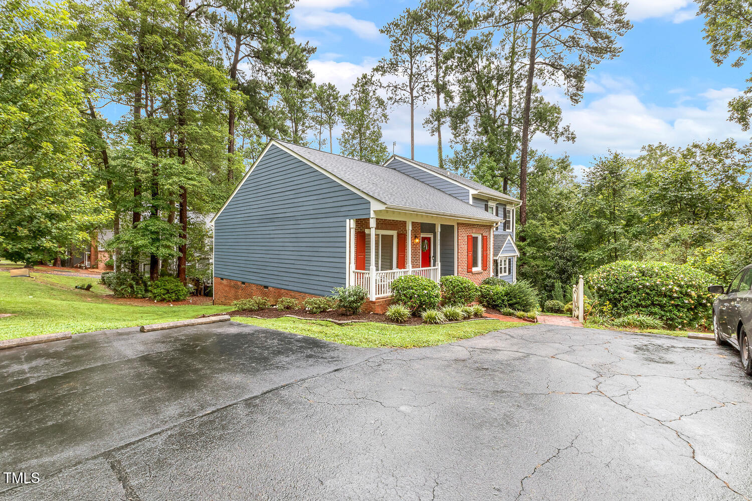 217 Danforth Drive Cary, NC 27511 - Photo 34 of 40 a front view of a house with a yard and garage