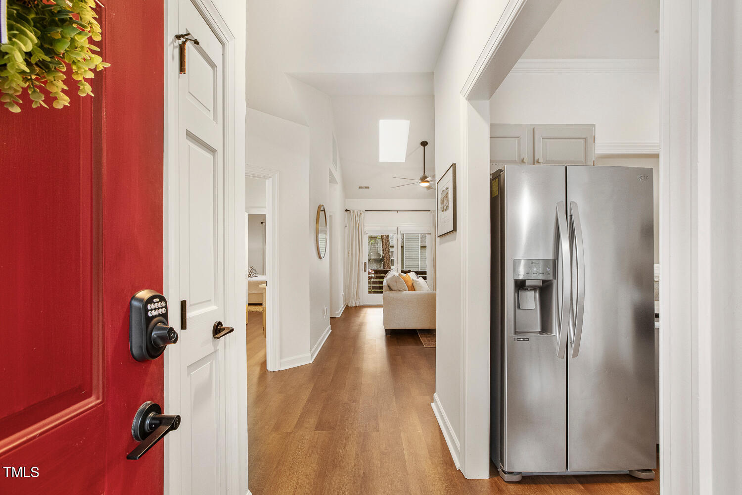 217 Danforth Drive Cary, NC 27511 - Photo 4 of 40 a view of a kitchen with refrigerator and wooden floor
