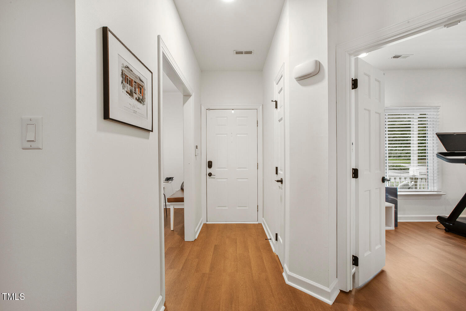 217 Danforth Drive Cary, NC 27511 - Photo 5 of 40 a view of a hallway view with wooden floor and staircase