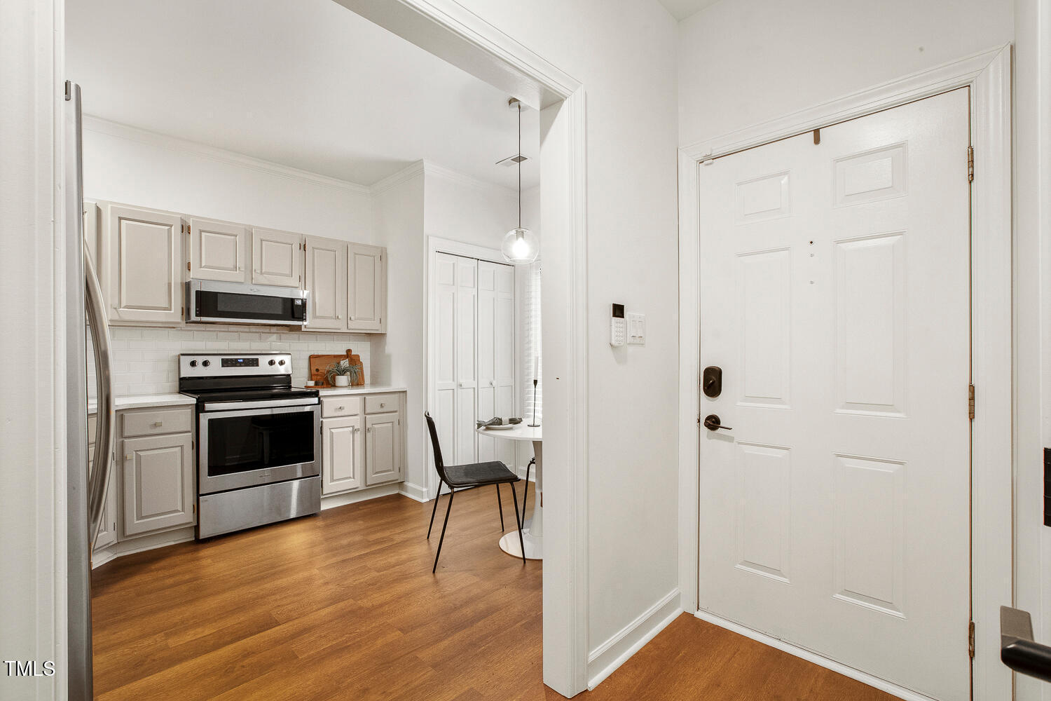 217 Danforth Drive Cary, NC 27511 - Photo 6 of 40 a kitchen with cabinets and wooden floor