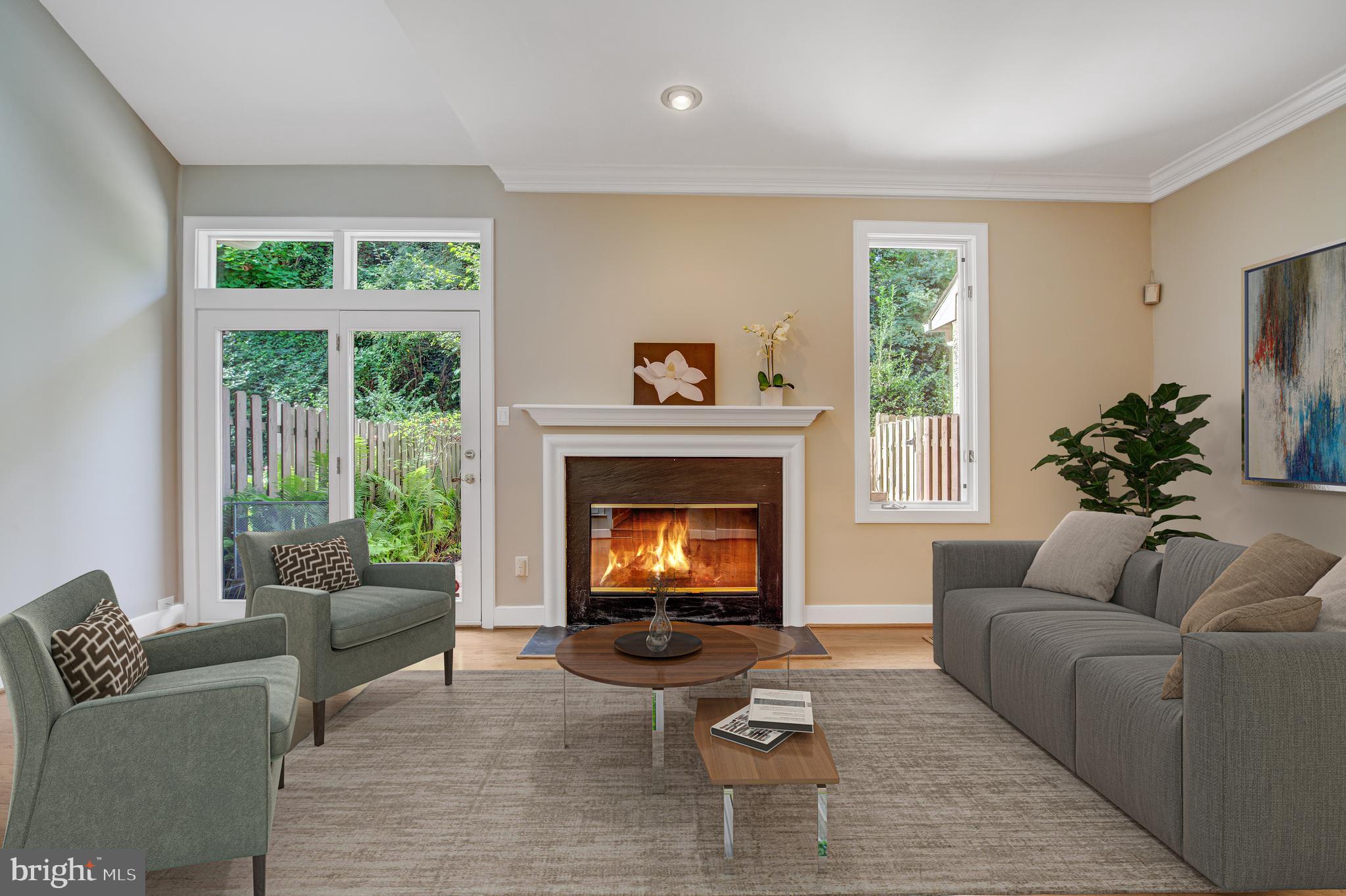 19 Greythorne Woods Circle, Unit 19 Wayne, PA 19087 - Photo 2 of 46 Living room opens to patio - virtually staged
