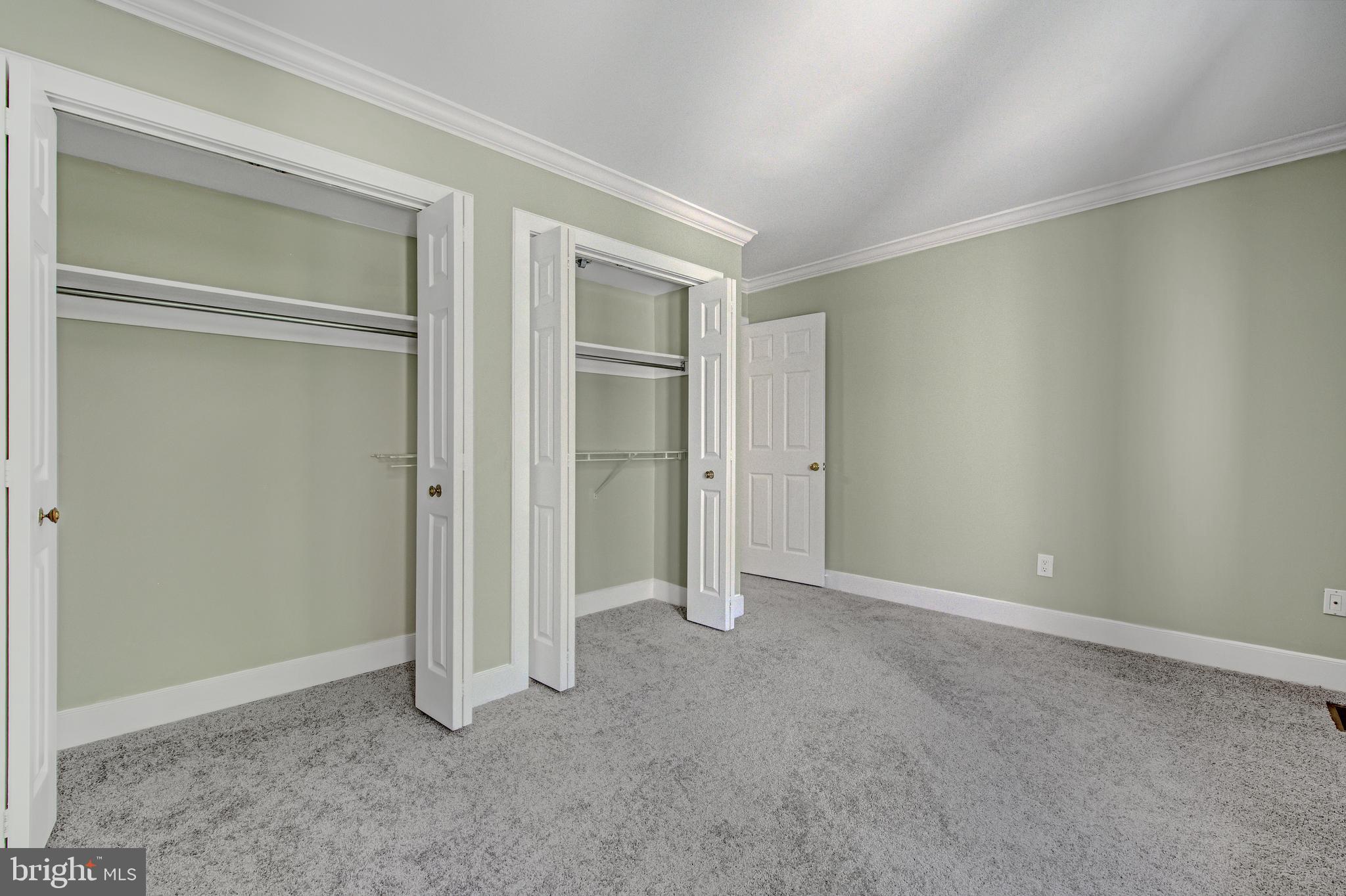 19 Greythorne Woods Circle, Unit 19 Wayne, PA 19087 - Photo 30 of 46 Dual closets in guest bedroom