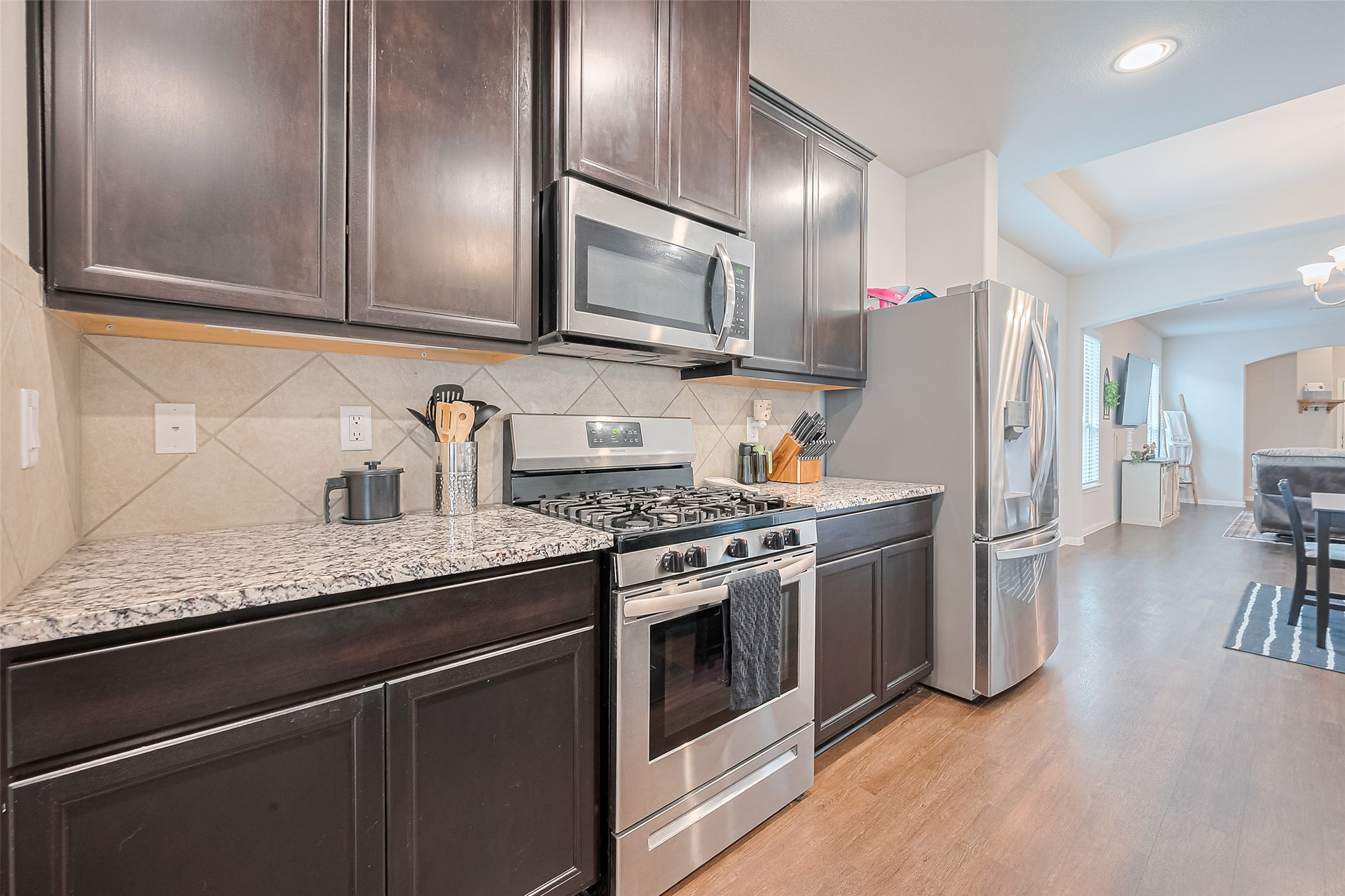 1214 Red Hills Drive Rosharon, TX 77583 - Photo 13 of 46 a kitchen with stainless steel appliances granite countertop a stove a refrigerator and a sink