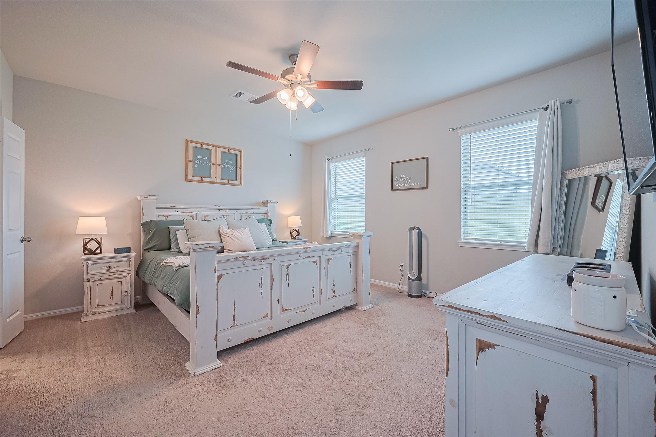 1214 Red Hills Drive Rosharon, TX 77583 - Photo 15 of 46 a spacious bedroom with a bed and a chandelier