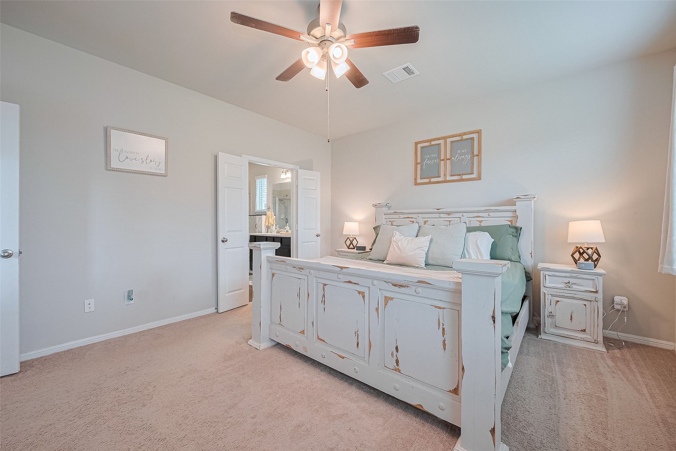 1214 Red Hills Drive Rosharon, TX 77583 - Photo 16 of 46 a bedroom with a bed and a chandelier