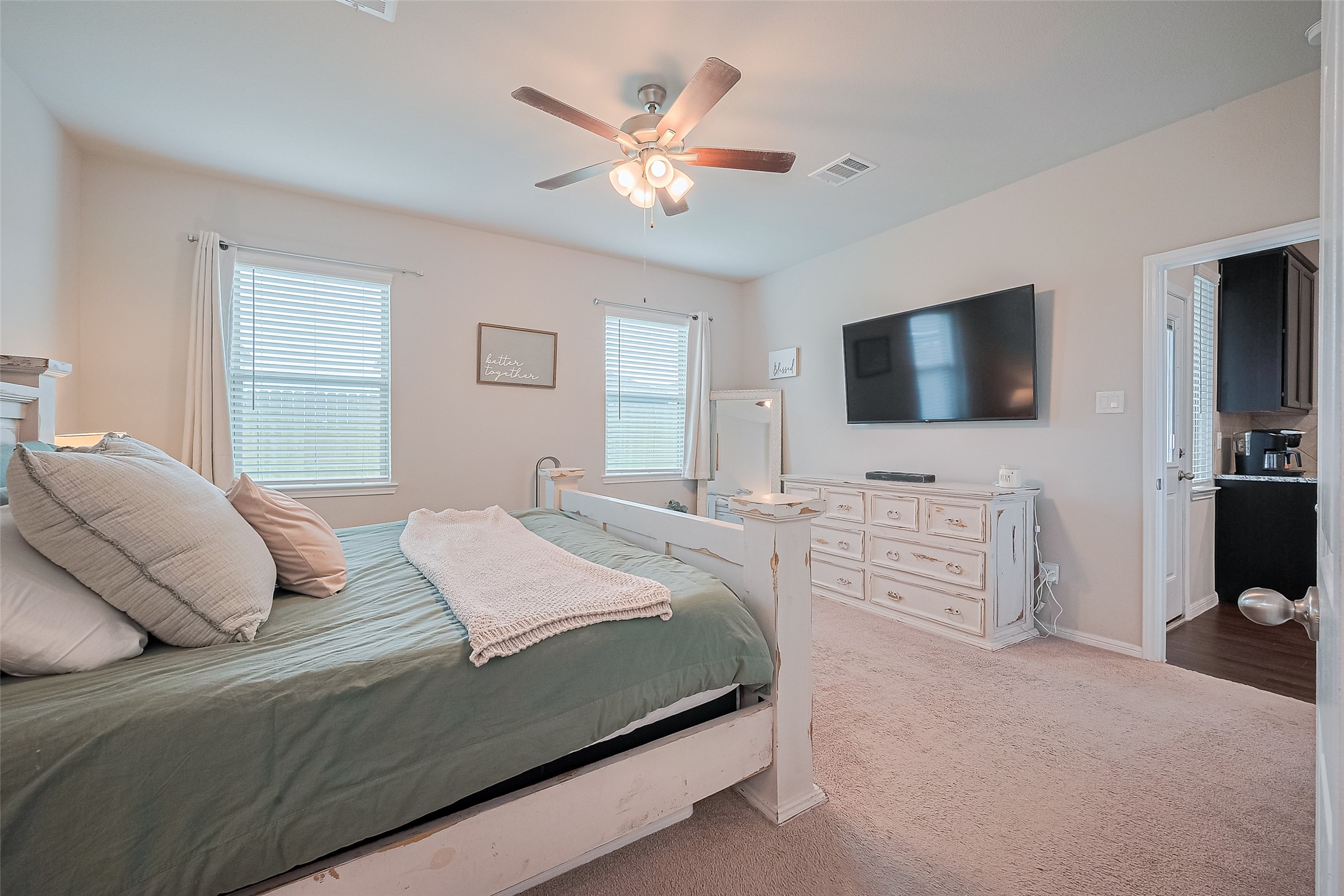 1214 Red Hills Drive Rosharon, TX 77583 - Photo 17 of 46 a bedroom with a large bed and a flat screen tv