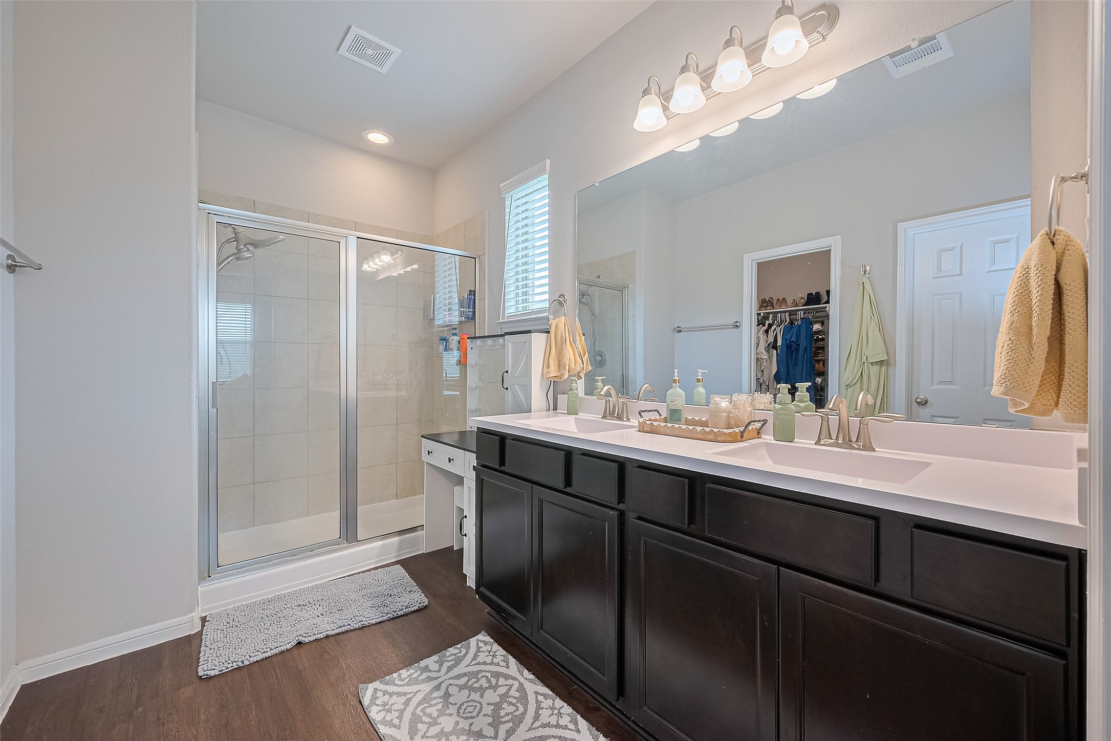 1214 Red Hills Drive Rosharon, TX 77583 - Photo 18 of 46 a bathroom with a double vanity sink mirror and shower