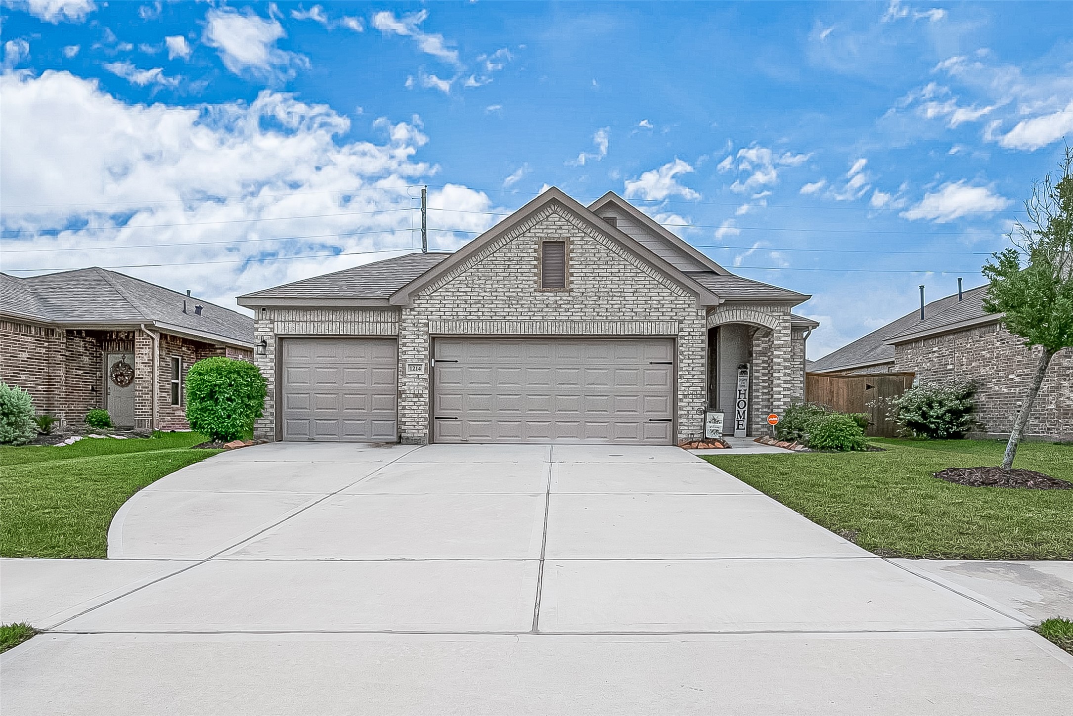 1214 Red Hills Drive Rosharon, TX 77583 - Photo 2 of 46 a front view of a house with a yard and garage