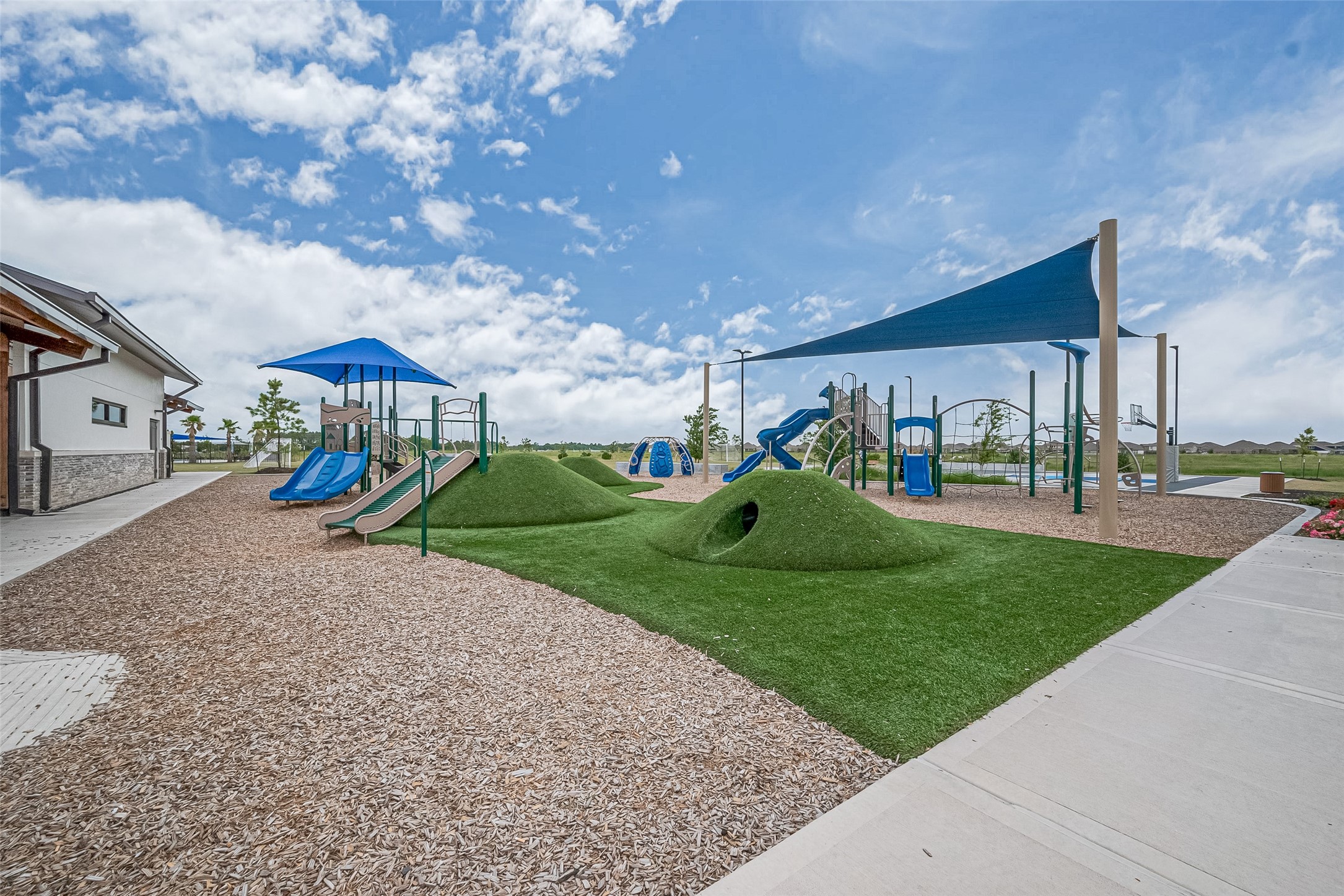 1214 Red Hills Drive Rosharon, TX 77583 - Photo 34 of 46 a childrens park with lots of swings and slides