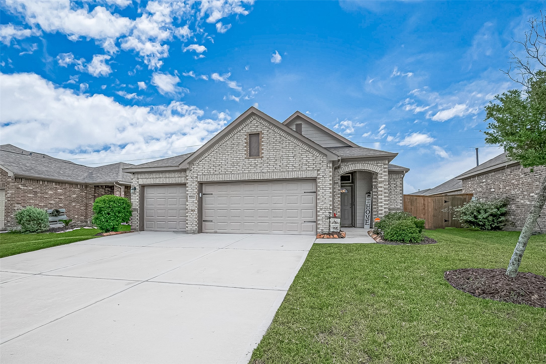 1214 Red Hills Drive Rosharon, TX 77583 - Photo 4 of 46 a front view of a house with a yard and garage