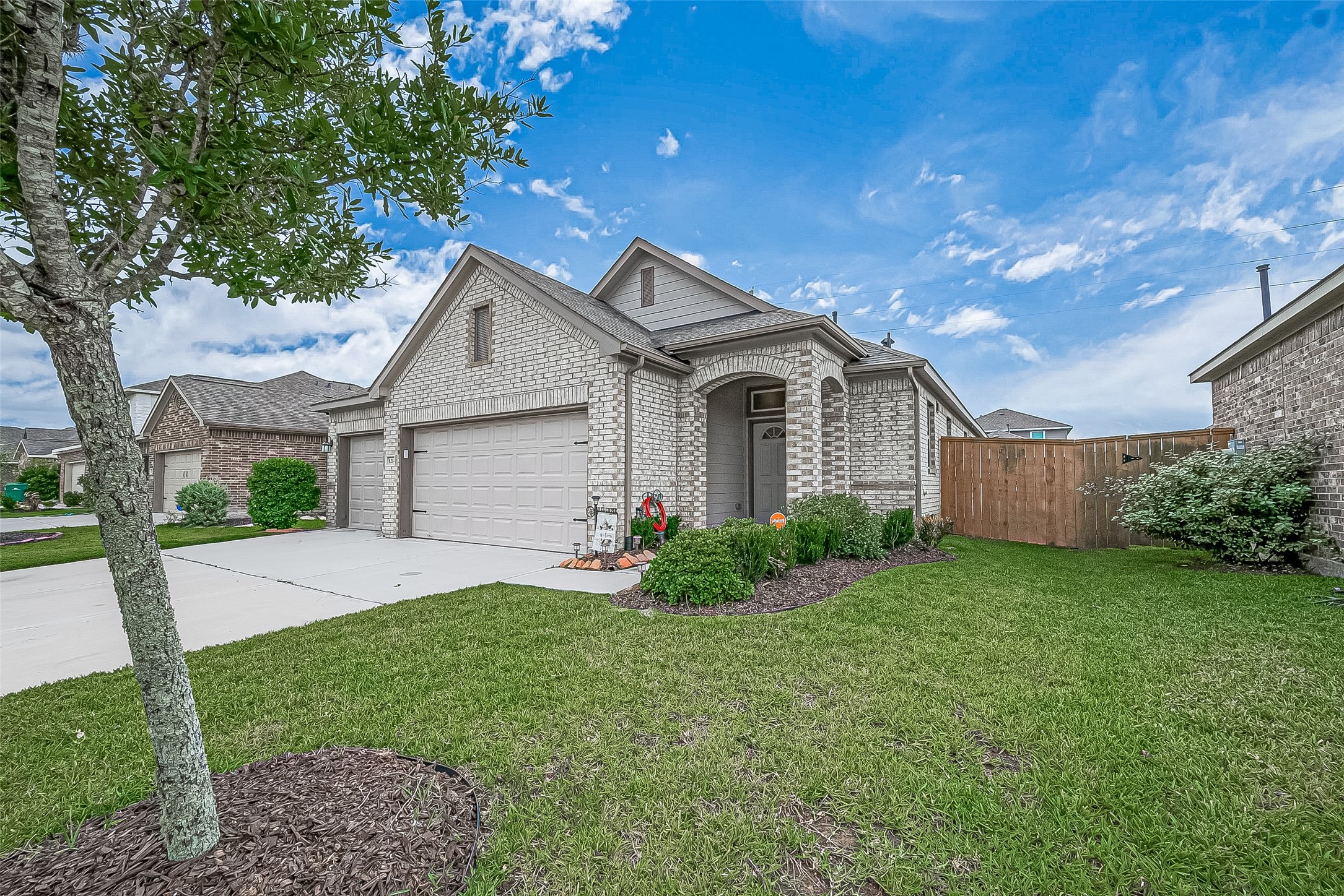 1214 Red Hills Drive Rosharon, TX 77583 - Photo 46 of 46 a front view of a house with a yard and garage