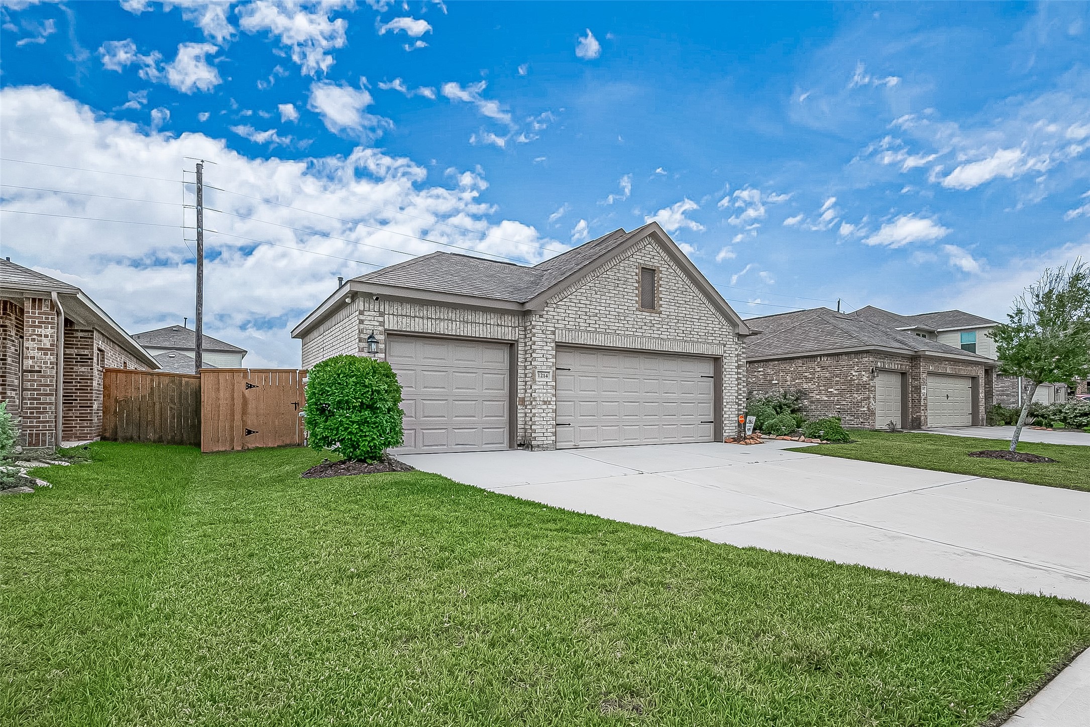 1214 Red Hills Drive Rosharon, TX 77583 - Photo 5 of 46 a front view of a house with a yard and garage