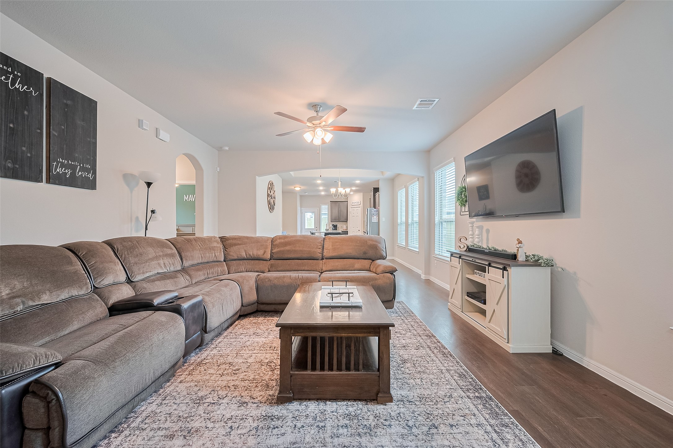 1214 Red Hills Drive Rosharon, TX 77583 - Photo 6 of 46 a living room with furniture a fireplace and a flat screen tv