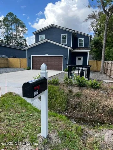 a front view of house with yard and seating area