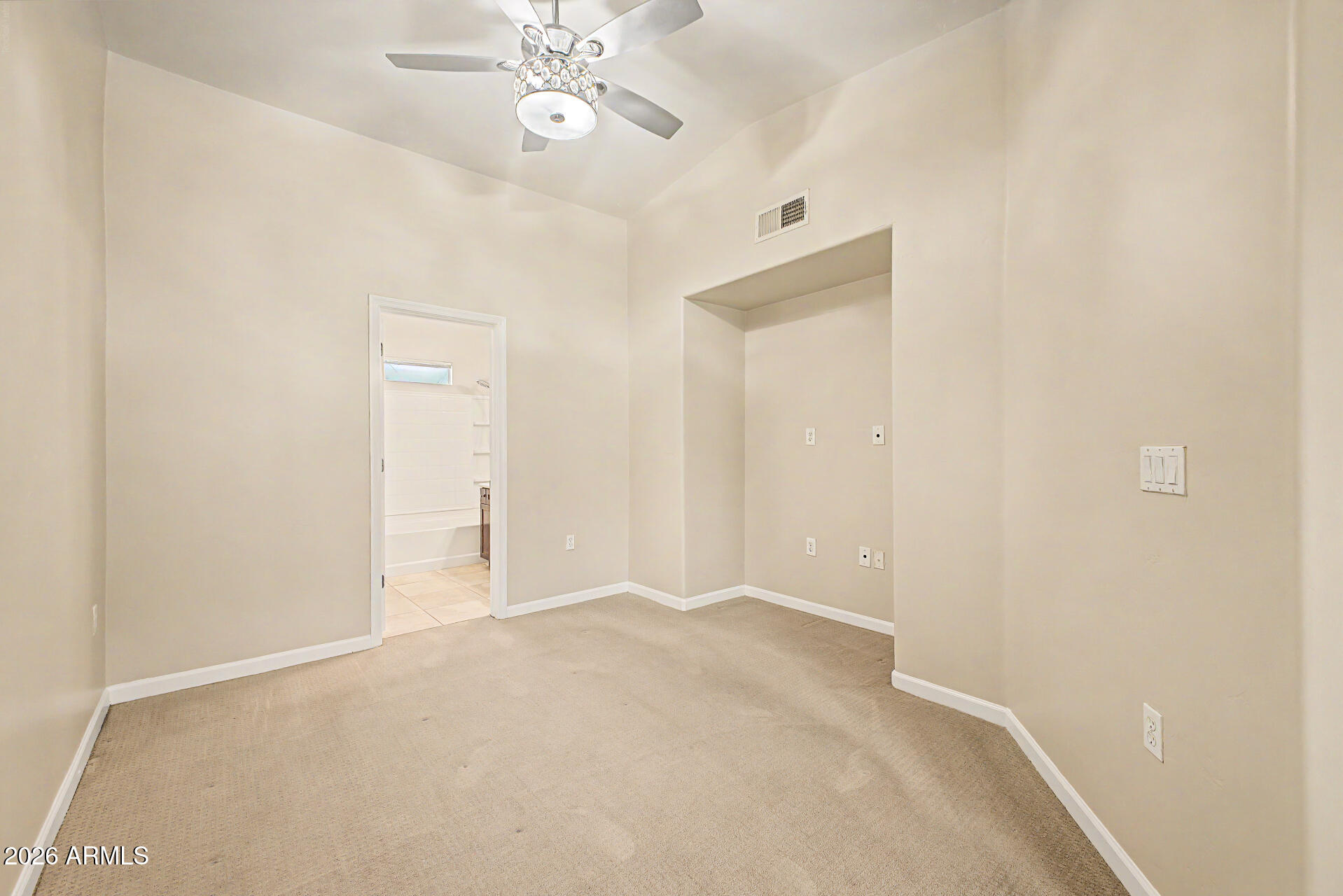 1920 East Bell Road, Unit 1173 Phoenix, AZ 85022 - Photo 11 of 33 an empty room with chandelier fan and closet