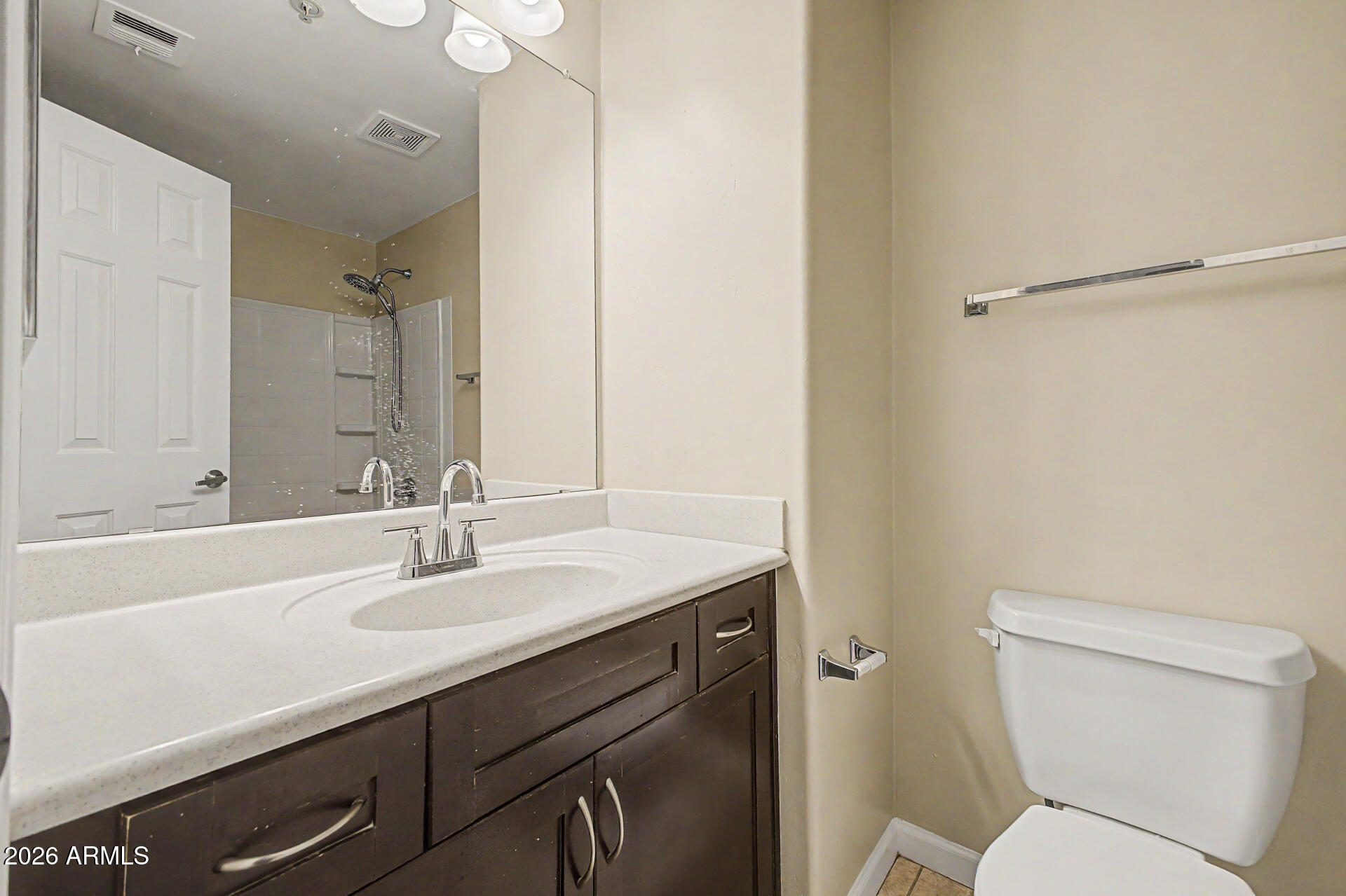 1920 East Bell Road, Unit 1173 Phoenix, AZ 85022 - Photo 19 of 33 a bathroom with a sink toilet and a mirror