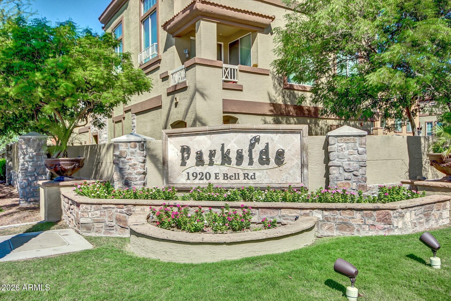 1920 East Bell Road, Unit 1173 Phoenix, AZ 85022 - Photo 22 of 33 a front view of a house with a yard