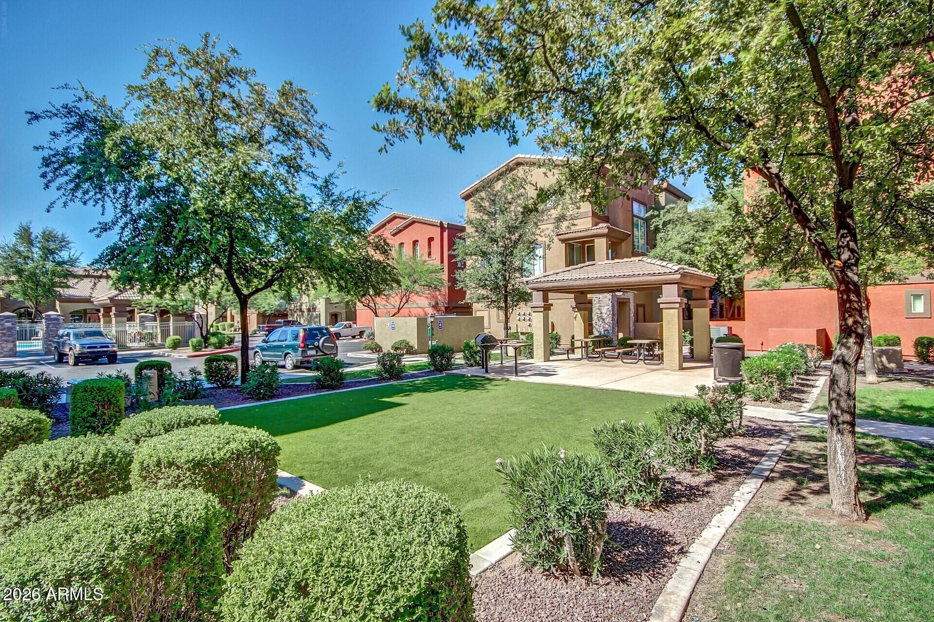 1920 East Bell Road, Unit 1173 Phoenix, AZ 85022 - Photo 31 of 33 a front view of a house with garden