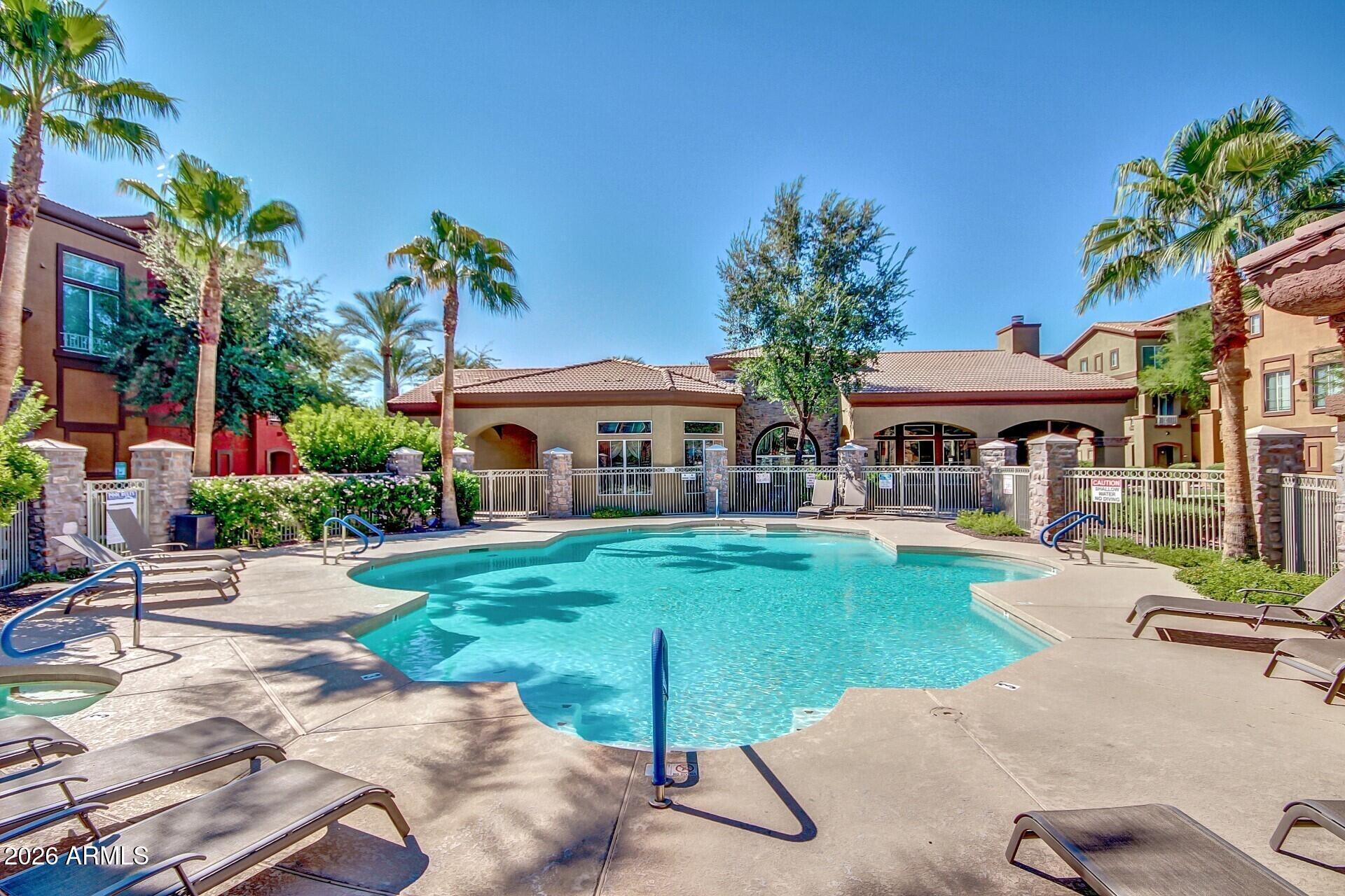 1920 East Bell Road, Unit 1173 Phoenix, AZ 85022 - Photo 32 of 33 a front view of a house with garden