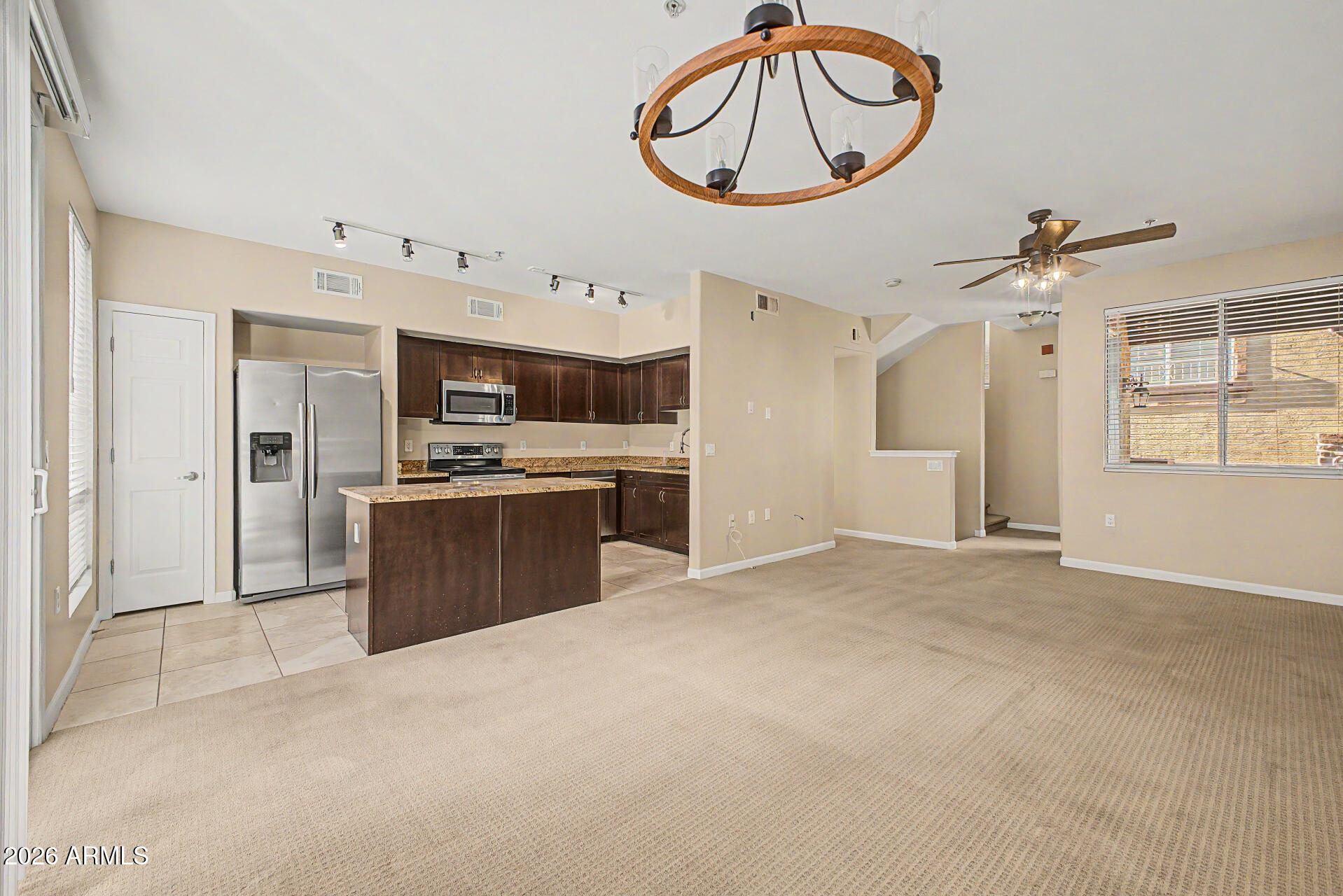 1920 East Bell Road, Unit 1173 Phoenix, AZ 85022 - Photo 6 of 33 a view of kitchen with stainless steel appliances granite countertop cabinets and window