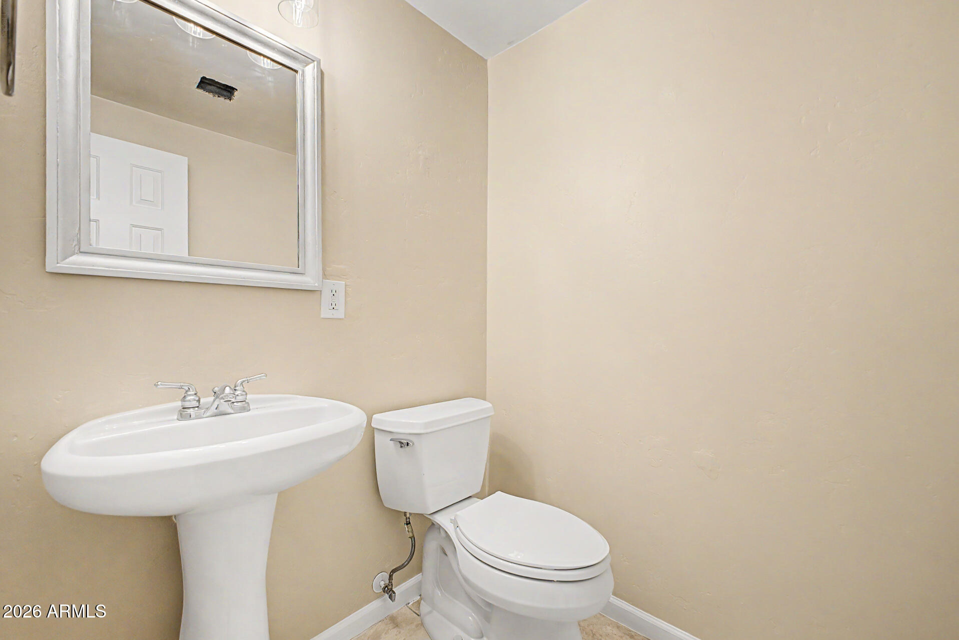 1920 East Bell Road, Unit 1173 Phoenix, AZ 85022 - Photo 10 of 33 a bathroom with a sink a toilet and mirror