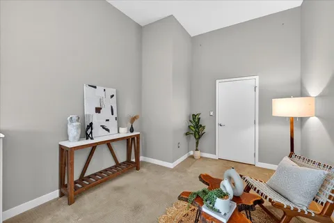 a bedroom with furniture and a dresser