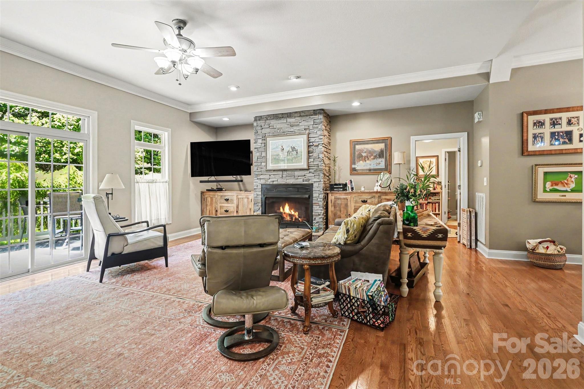 4037 Old Williamston Road Belton, SC 29627 - Photo 9 of 41 a living room with furniture a fireplace and a flat screen tv