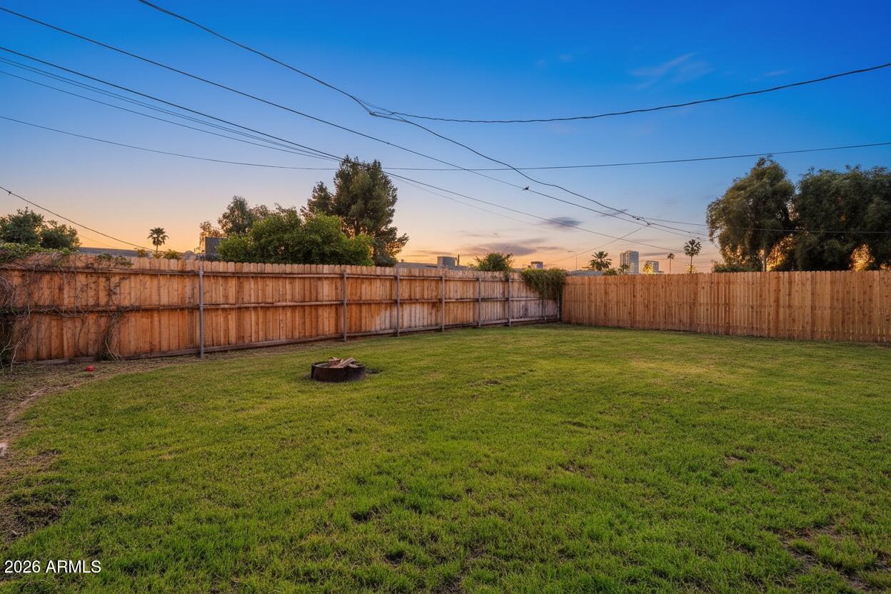 1052 West Elna Rae Street Tempe, AZ 85281 - Photo 14 of 16 a view of a backyard with a garden