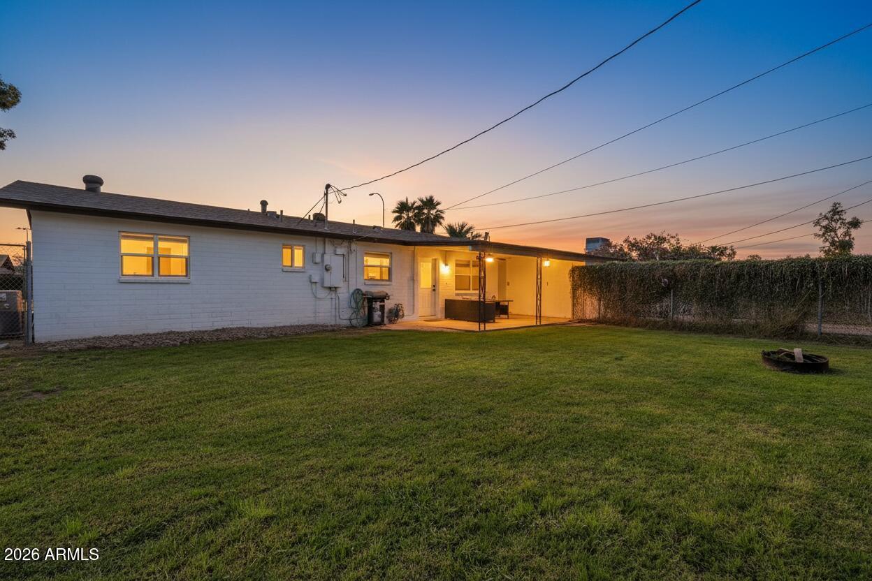 1052 West Elna Rae Street Tempe, AZ 85281 - Photo 15 of 16 a front view of a house with a garden