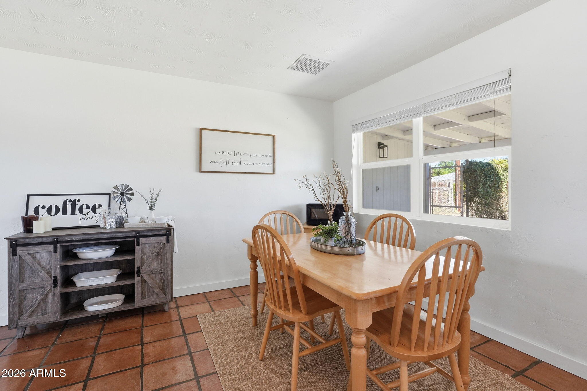 1052 West Elna Rae Street Tempe, AZ 85281 - Photo 5 of 16 a view of a dining room with furniture