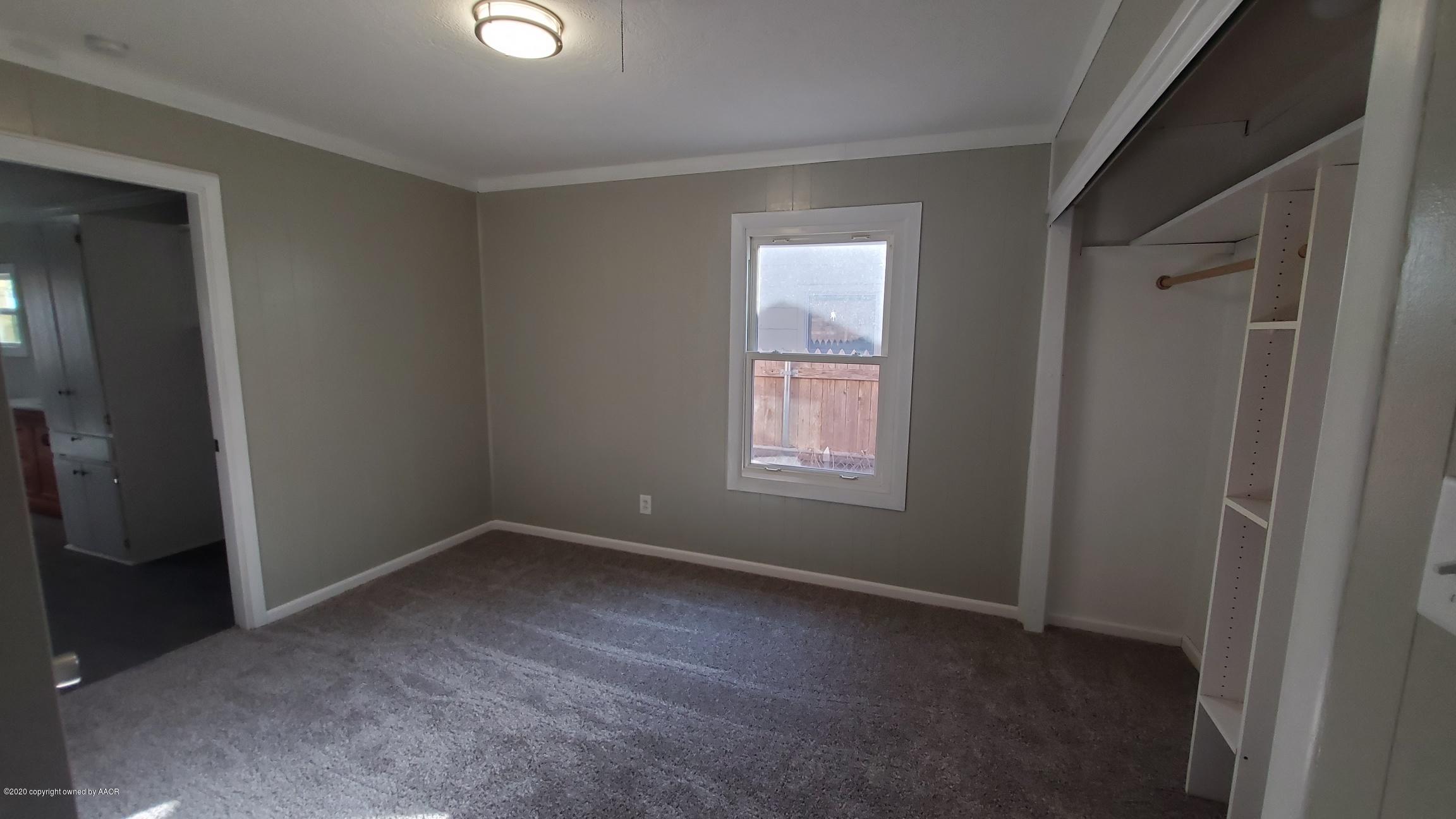 3809 South Jackson Street Amarillo, TX 79110 - Photo 11 of 17 an empty room with windows and closet