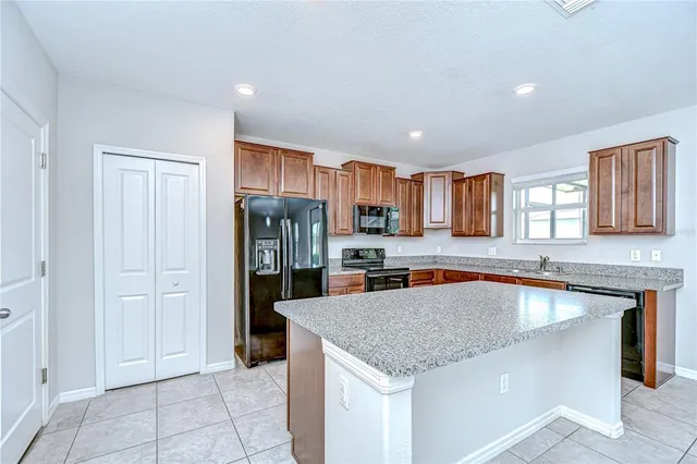 a kitchen with a sink counter top space and cabinets