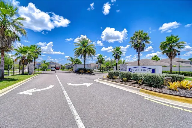 a sign that is sitting in front of flowers