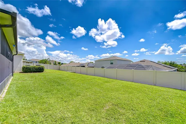 a view of a yard with a house