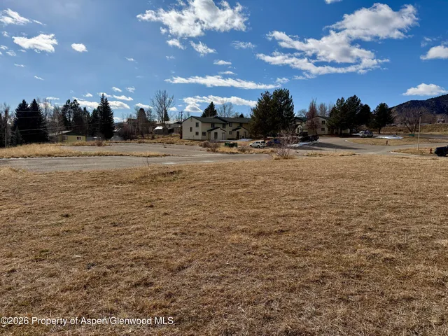a view of a building with a yard