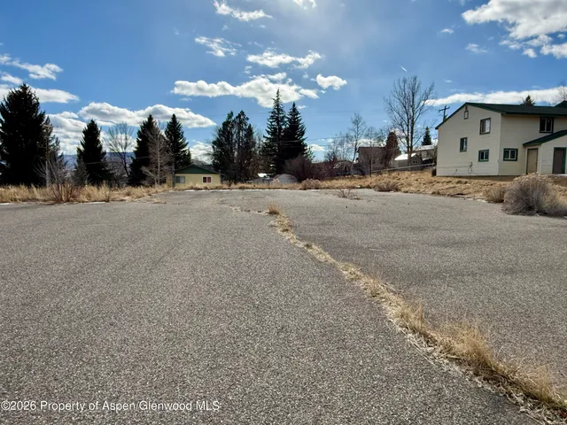 a view of the house with a yard