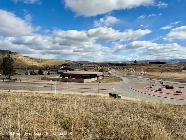 a view of a swimming pool with an outdoor seating