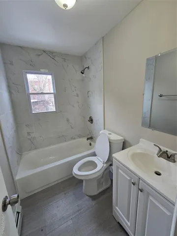 a view of a yard with wooden fence