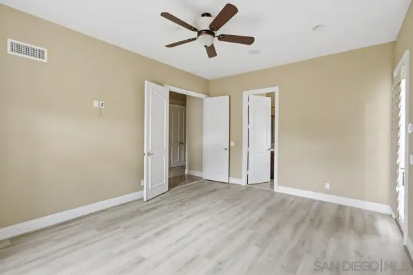 a bathroom with a granite countertop sink a toilet and a bathtub