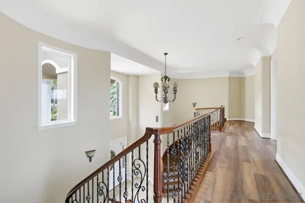 a bathroom with a granite countertop toilet a sink and mirror