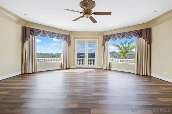 a kitchen with stainless steel appliances a large window a sink and a counter top space