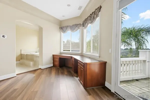 a view of a kitchen cabinets a sink and a window