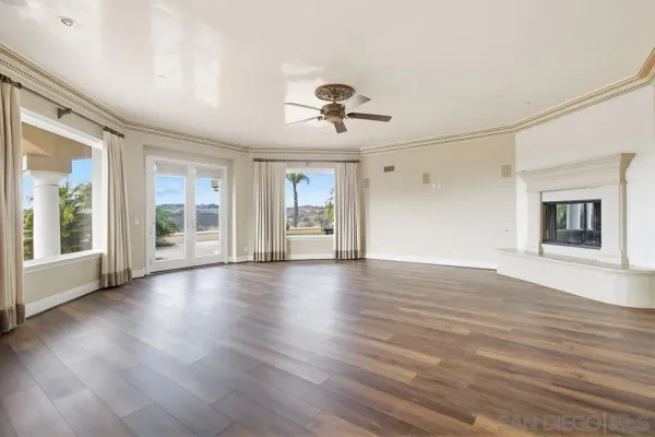 a large kitchen with stainless steel appliances granite countertop a stove a sink and a microwave