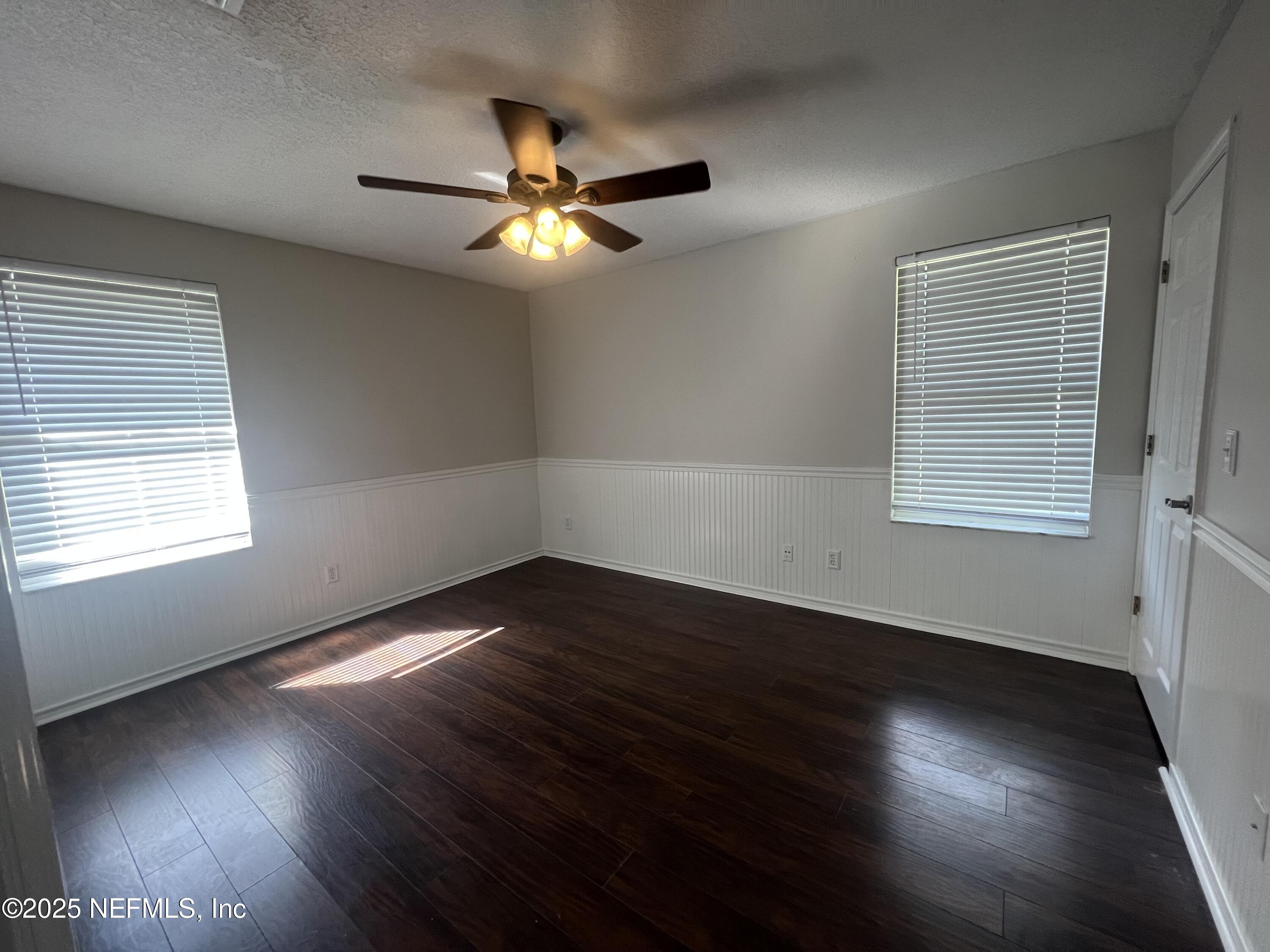 1508 Center Street Green Cove Springs, FL 32043 - Photo 14 of 24 a view of an empty room with wooden floor and a window